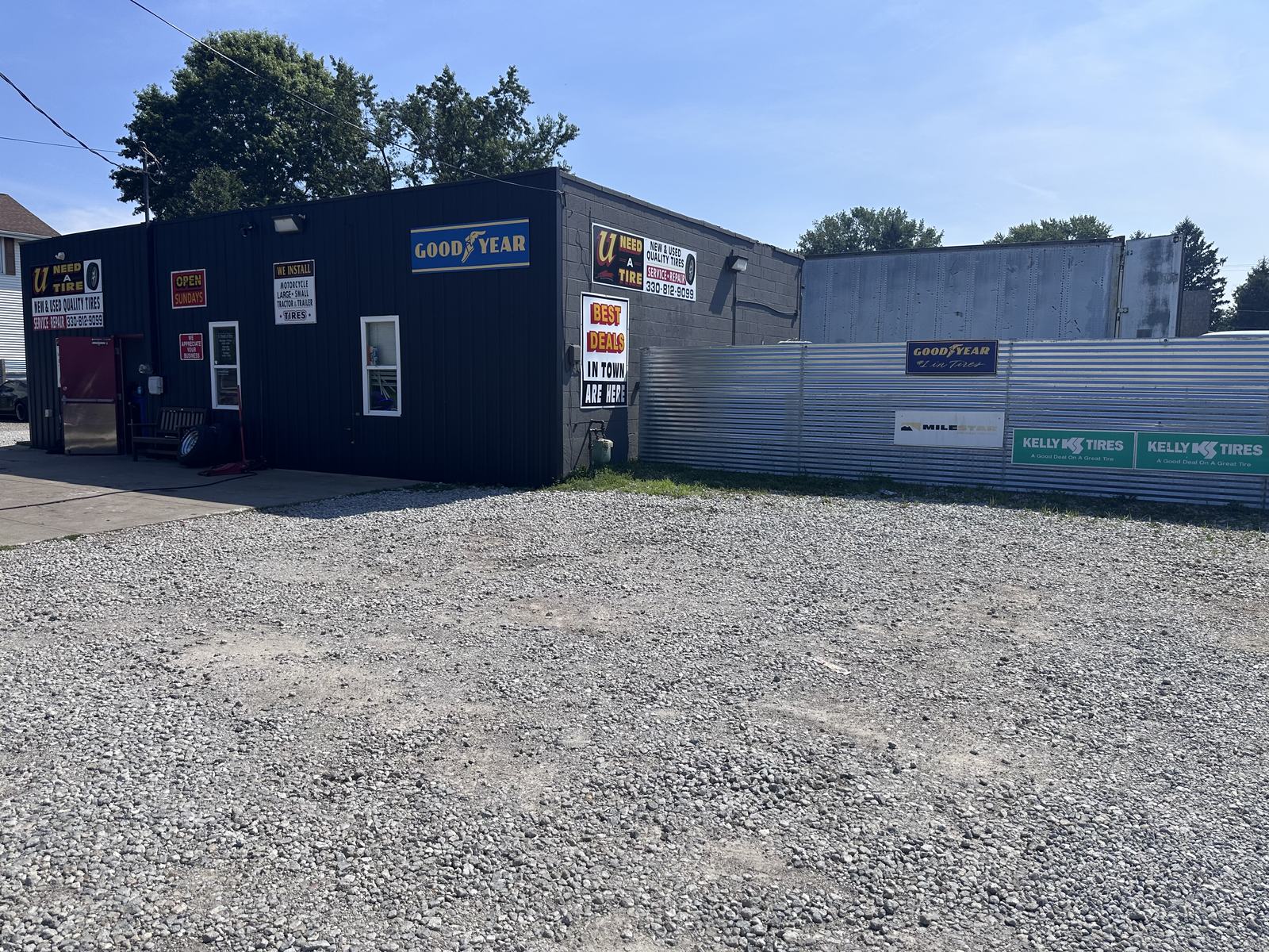 U Need A Tire shop and tire yard in Akron, Ohio with Goodyear and Kelly Tires signs